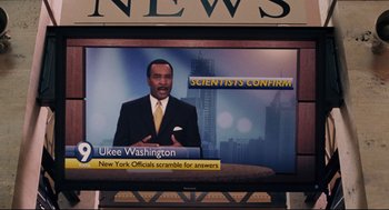 Movie still from “The Happening” (2008), directed by M. Night Shyamalan – A television screen showing a news anchor; Close Up shot, High angle
