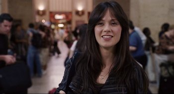 Movie still from “The Happening” (2008), directed by M. Night Shyamalan – A beautiful young lady with long black hair; Close Up shot, Over the shoulder angle