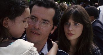 Movie still from “The Happening” (2008), directed by M. Night Shyamalan – A man and a woman and a child looking at the camera; Close Up shot, Over the shoulder angle