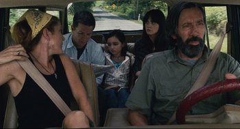 Movie still from “The Happening” (2008), directed by M. Night Shyamalan – A group of people sitting in the back of a car; Medium shot, Over the shoulder angle