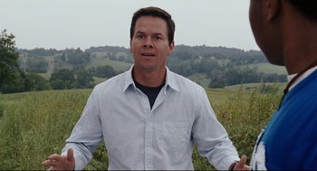 Movie still from “The Happening” (2008), directed by M. Night Shyamalan – A person standing in a field; Close Up shot, Low angle