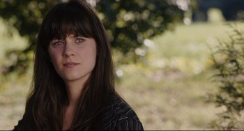 Movie still from “The Happening” (2008), directed by M. Night Shyamalan – A person with long brown hair; Close Up shot, Over the shoulder angle