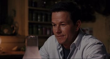 Movie still from “The Happening” (2008), directed by M. Night Shyamalan – A person sitting at a table; Close Up shot, Over the shoulder angle