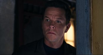 Movie still from “The Happening” (2008), directed by M. Night Shyamalan – A person wearing a black shirt; Close Up shot, Low angle