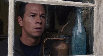 Movie still from “The Happening” (2008), directed by M. Night Shyamalan – A person looking at the camera; Close Up shot, Low angle