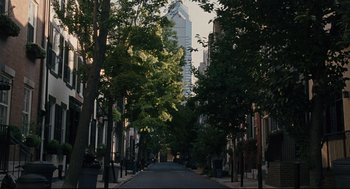 Movie still from “The Happening” (2008), directed by M. Night Shyamalan – A city street lined with tall buildings and trees; Extreme Wide shot, High angle