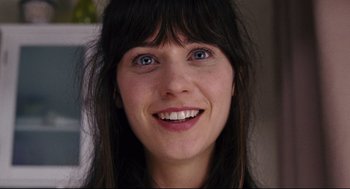Movie still from “The Happening” (2008), directed by M. Night Shyamalan – A person with blue eyes smiling; Close Up shot, Over the shoulder angle