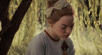 Movie still from “The Help” (2011), directed by Tate Taylor – A woman with a bow in her hair and wearing a headband; Close Up shot, Over the shoulder angle