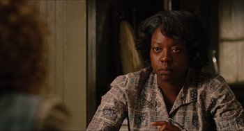 Movie still from “The Help” (2011), directed by Tate Taylor – A woman sitting in front of a mirror; Close Up shot, Over the shoulder angle