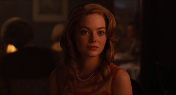 Movie still from “The Help” (2011), directed by Tate Taylor – A beautiful young woman with red hair wearing a necklace; Close Up shot, Over the shoulder angle