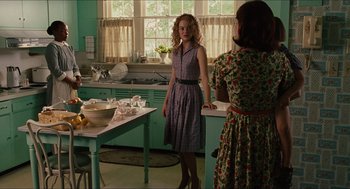 Movie still from “The Help” (2011), directed by Tate Taylor – Two women standing in a kitchen next to each other; Medium shot, Over the shoulder angle