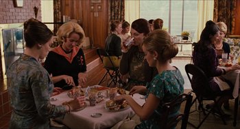 Movie still from “The Help” (2011), directed by Tate Taylor – A group of women sitting at a table eating food; Medium shot, High angle