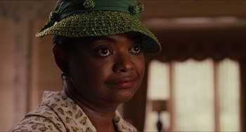 Movie still from “The Help” (2011), directed by Tate Taylor – A person wearing a hat; Close Up shot, Over the shoulder angle