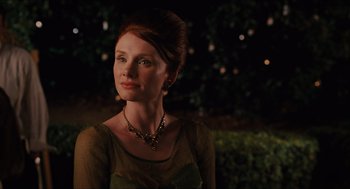 Movie still from “The Help” (2011), directed by Tate Taylor – A woman in a green dress with a necklace; Close Up shot, Over the shoulder angle