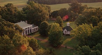 Movie still from “The Help” (2011), directed by Tate Taylor – An aerial view of a house and some trees; Extreme Wide shot, High angle
