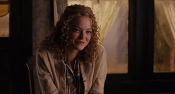 Movie still from “The Help” (2011), directed by Tate Taylor – A woman sitting in front of a window smiling for the camera; Close Up shot, Over the shoulder angle