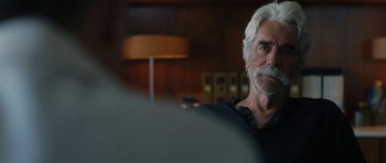 Movie still from “The Hero” (2017), directed by Brett Haley – An older man with white hair and a beard; Close Up shot, Over the shoulder angle