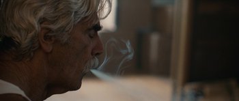 Movie still from “The Hero” (2017), directed by Brett Haley – A person smoking a cigarette; Close Up shot, Low angle