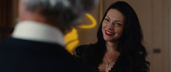 Movie still from “The Hero” (2017), directed by Brett Haley – A woman smiles brightly as she sits in front of a mirror; Close Up shot, Over the shoulder angle