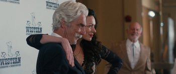 Movie still from “The Hero” (2017), directed by Brett Haley – A man and a woman posing for a picture; Close Up shot, Over the shoulder angle