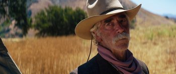 Movie still from “The Hero” (2017), directed by Brett Haley – An older man with a hat and a beard; Close Up shot, Over the shoulder angle