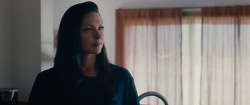 Movie still from “The Hero” (2017), directed by Brett Haley – A woman standing in front of a window looking to her left; Close Up shot, Over the shoulder angle