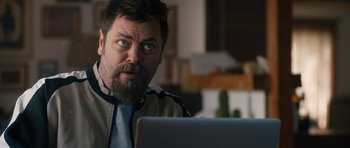 Movie still from “The Hero” (2017), directed by Brett Haley – A person sitting at a table with a laptop; Close Up shot, Over the shoulder angle