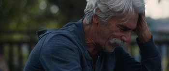 Movie still from “The Hero” (2017), directed by Brett Haley – An older man with white hair and a gray beard; Close Up shot, Over the shoulder angle