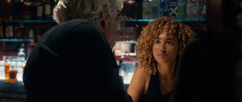 Movie still from “The Hero” (2017), directed by Brett Haley – A woman sitting next to a man in a restaurant; Close Up shot, Over the shoulder angle