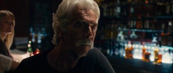 Movie still from “The Hero” (2017), directed by Brett Haley – An older man with white hair and a beard; Close Up shot, Over the shoulder angle