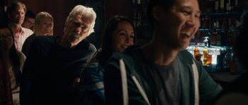 Movie still from “The Hero” (2017), directed by Brett Haley – An old man and a young woman sitting next to each other; Close Up shot, Over the shoulder angle