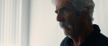 Movie still from “The Hero” (2017), directed by Brett Haley – An older man with white hair and a mustache; Close Up shot, Over the shoulder angle