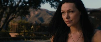 Movie still from “The Hero” (2017), directed by Brett Haley – A person with long black hair; Close Up shot, Over the shoulder angle