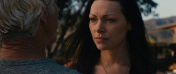 Movie still from “The Hero” (2017), directed by Brett Haley – A person with long black hair; Close Up shot, Over the shoulder angle