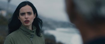 Movie still from “The Hero” (2017), directed by Brett Haley – A woman standing in front of a body of water; Close Up shot, Over the shoulder angle