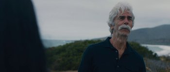 Movie still from “The Hero” (2017), directed by Brett Haley – An older man standing in front of the ocean; Close Up shot, Over the shoulder angle
