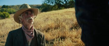 Movie still from “The Hero” (2017), directed by Brett Haley – An old man wearing a cowboy hat in a field; Close Up shot, Over the shoulder angle