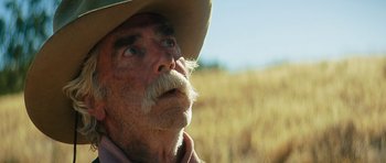 Movie still from “The Hero” (2017), directed by Brett Haley – An old man with a beard wearing a cowboy hat; Close Up shot, Low angle