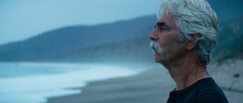 Movie still from “The Hero” (2017), directed by Brett Haley – An older man with a white beard looking out at the ocean; Close Up shot, Low angle