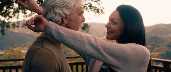 Movie still from “The Hero” (2017), directed by Brett Haley – An older man and a younger woman are smiling; Close Up shot, Over the shoulder angle