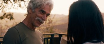 Movie still from “The Hero” (2017), directed by Brett Haley – An older man and a young woman are talking outside; Close Up shot, Over the shoulder angle