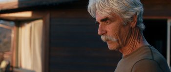 Movie still from “The Hero” (2017), directed by Brett Haley – An older man with white hair and a white mustache; Close Up shot, Over the shoulder angle