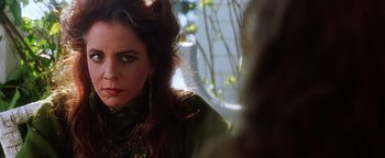 Movie still from “Practical Magic” (1998), directed by Griffin Dunne – A person with long red hair; Close Up shot, Over the shoulder angle