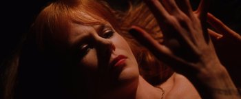 Movie still from “Practical Magic” (1998), directed by Griffin Dunne – A person laying on the ground; Close Up shot, Overhead angle