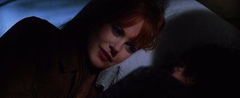Movie still from “Practical Magic” (1998), directed by Griffin Dunne – A person laying in a bed; Close Up shot, High angle
