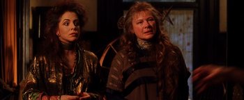 Movie still from “Practical Magic” (1998), directed by Griffin Dunne – Two women standing next to each other in front of a mirror; Close Up shot, Low angle