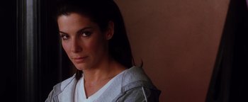 Movie still from “Practical Magic” (1998), directed by Griffin Dunne – A person with long dark hair; Close Up shot, Over the shoulder angle