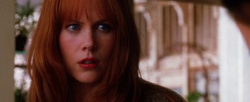 Movie still from “Practical Magic” (1998), directed by Griffin Dunne – A person with long red hair; Close Up shot, Low angle