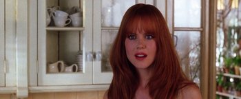 Movie still from “Practical Magic” (1998), directed by Griffin Dunne – A person with long red hair; Close Up shot, Over the shoulder angle