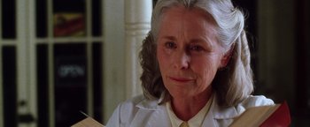 Movie still from “Practical Magic” (1998), directed by Griffin Dunne – An older woman is looking into the camera; Close Up shot, Low angle